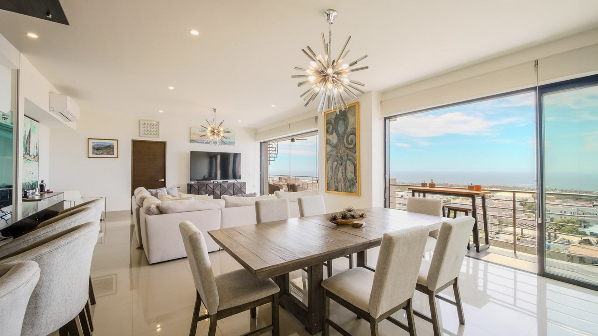 Refined condo interior with natural materials and ocean light in Los Cabos