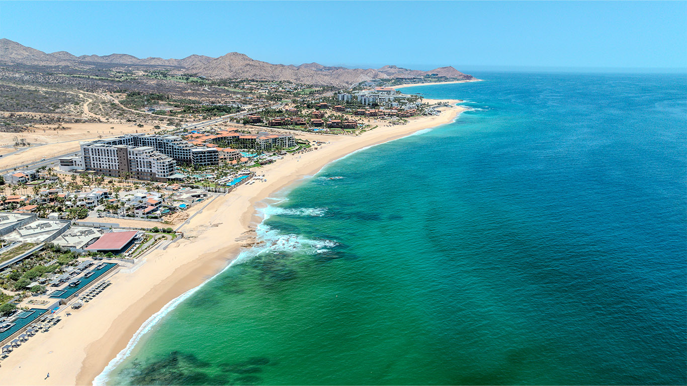 Aerial view of Los Cabos coastline and luxury homes along the Pacific and Sea of Cortez