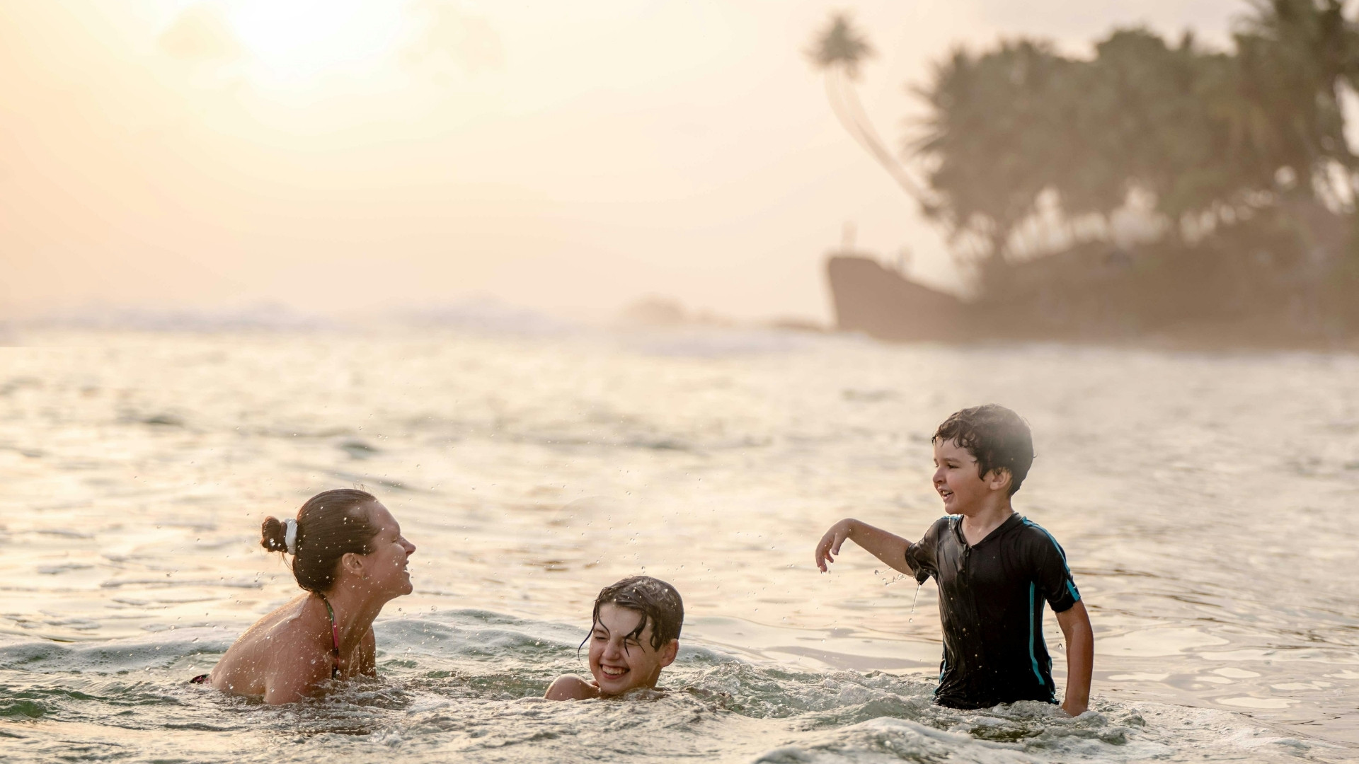 Family enjoying a calm, swimmable cove near San José del Cabo