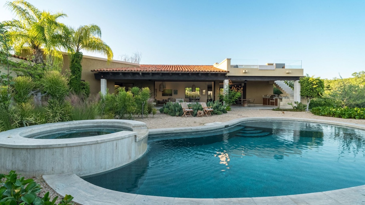 Luxury pool and terrace with the home visible in the background at Fundadores 164