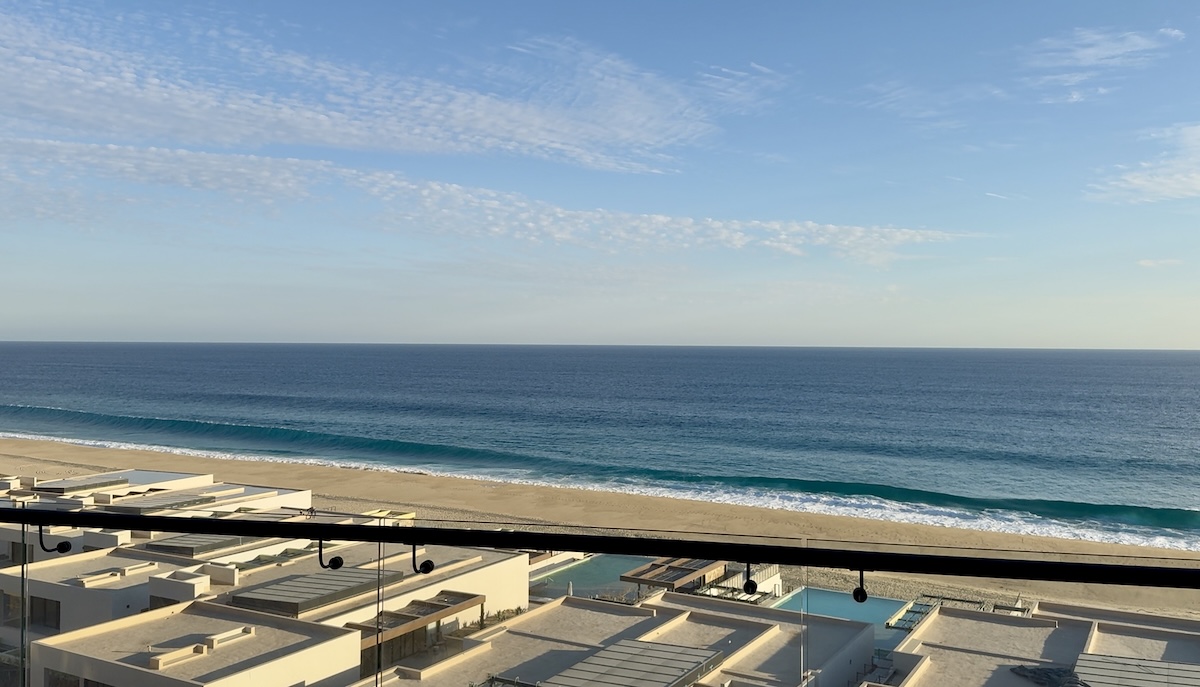 Private terrace of a St. Regis Cabo condo with unobstructed oceanfront views, outdoor hot tub, and seating area for relaxation