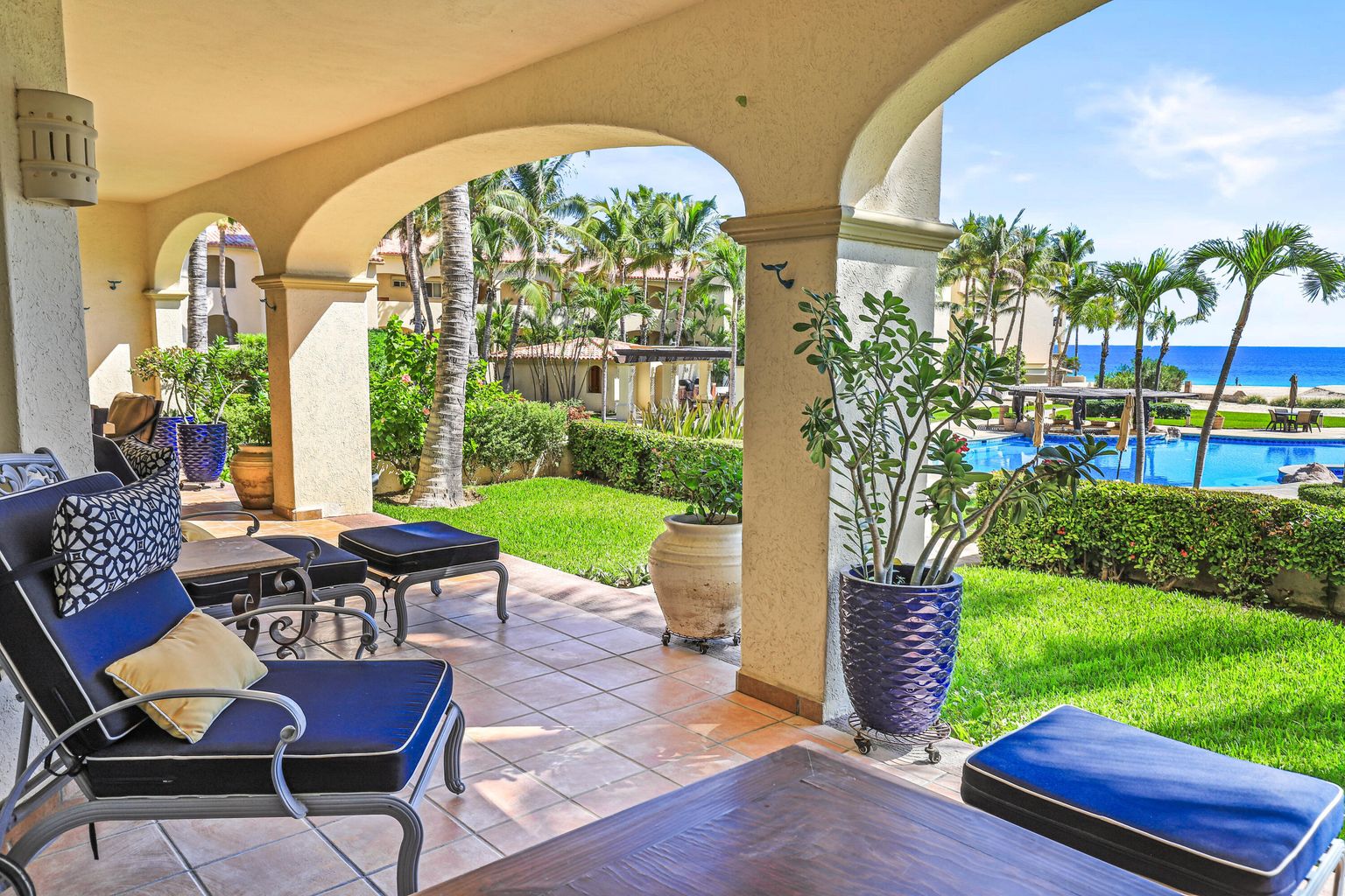 Private covered patio and grassy yard at Las Mañanitas 2-bedroom condo #3102